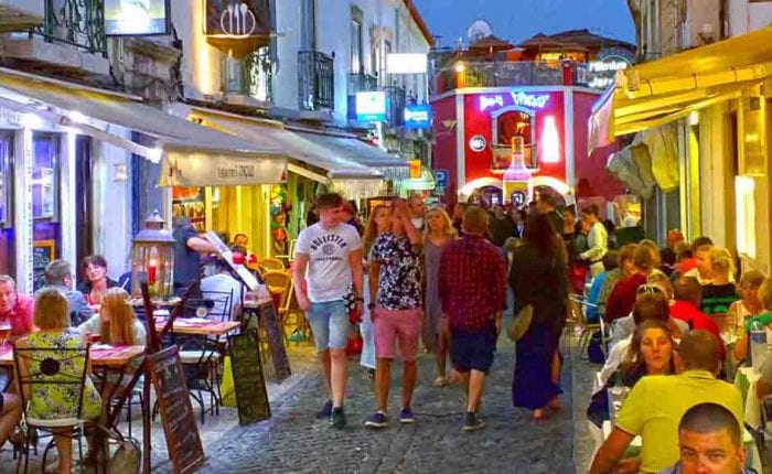 Bar street in Lagos, Algarve at night, bustling with tourists and local life in the heart of the Algarve region. Portugal travel tips