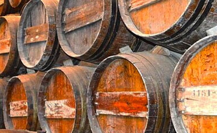 Traditional Portuguese wine barrels aging in a Douro Valley winery – wine tour in Portugal with Premiere Tours