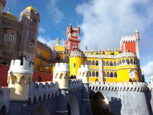 <img src="pena_palace_exterior.jpg" alt="Vibrant exterior of Pena Palace in Sintra, Portugal">