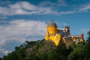 <img src="pena_palace_exterior.jpg" alt="Vibrant exterior of Pena Palace, in Sintra, Portugal">